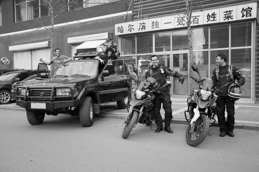 YakHead crew in front of Land Cruiser and Motorycles